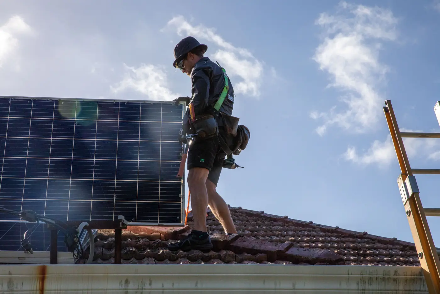 Clean Power Australia installer on a residential rooftop